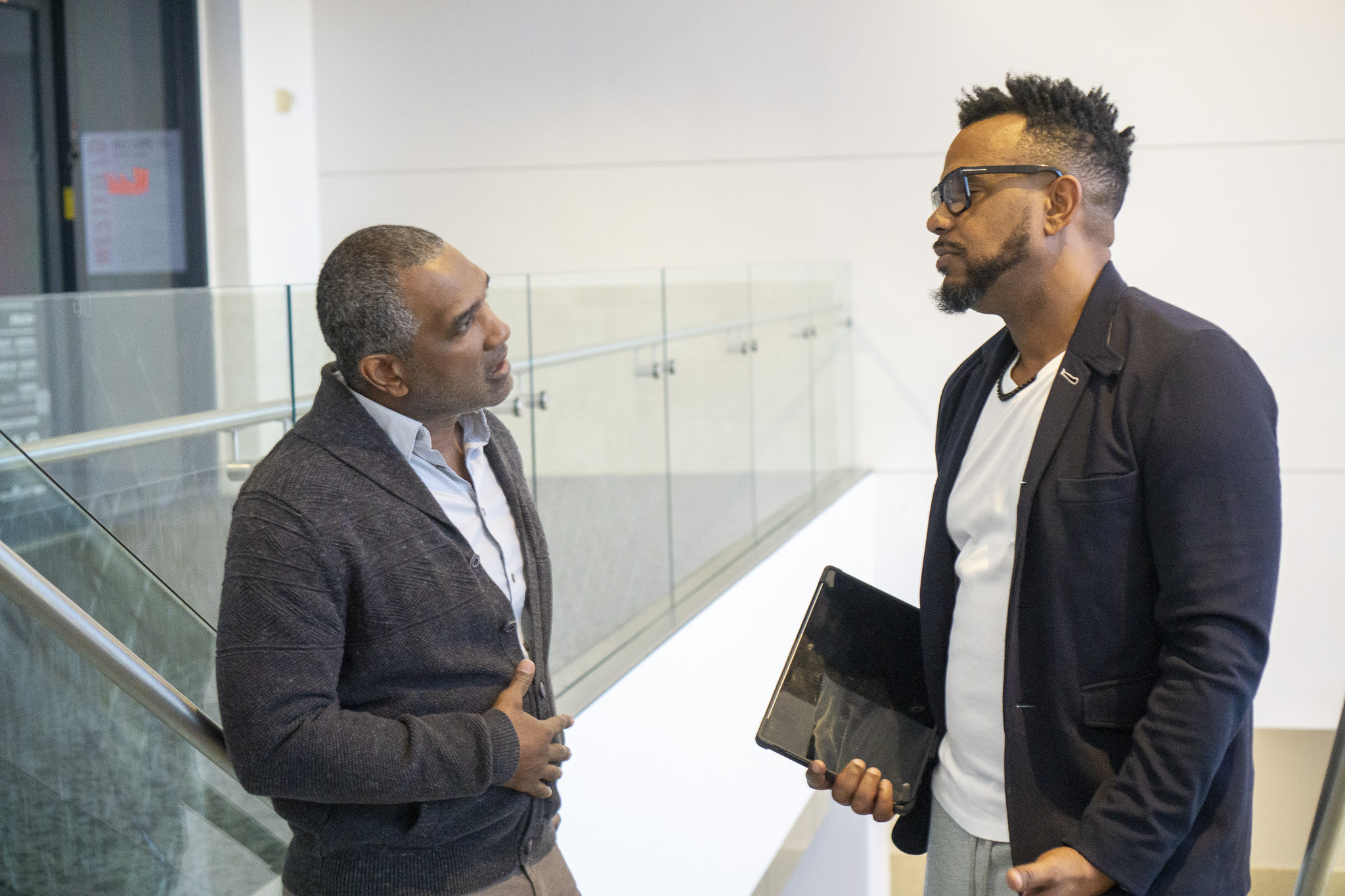 Michael Bowers in conversation with a client reviewing strategy